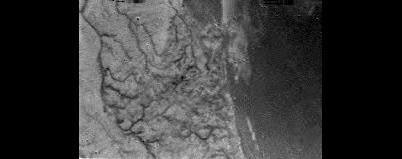 Black and white image from above Titan.
