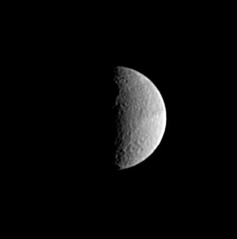black and white image of Tethys showing a large crater