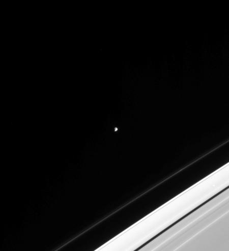 Saturn's moon Epimetheus near a portion of the rings