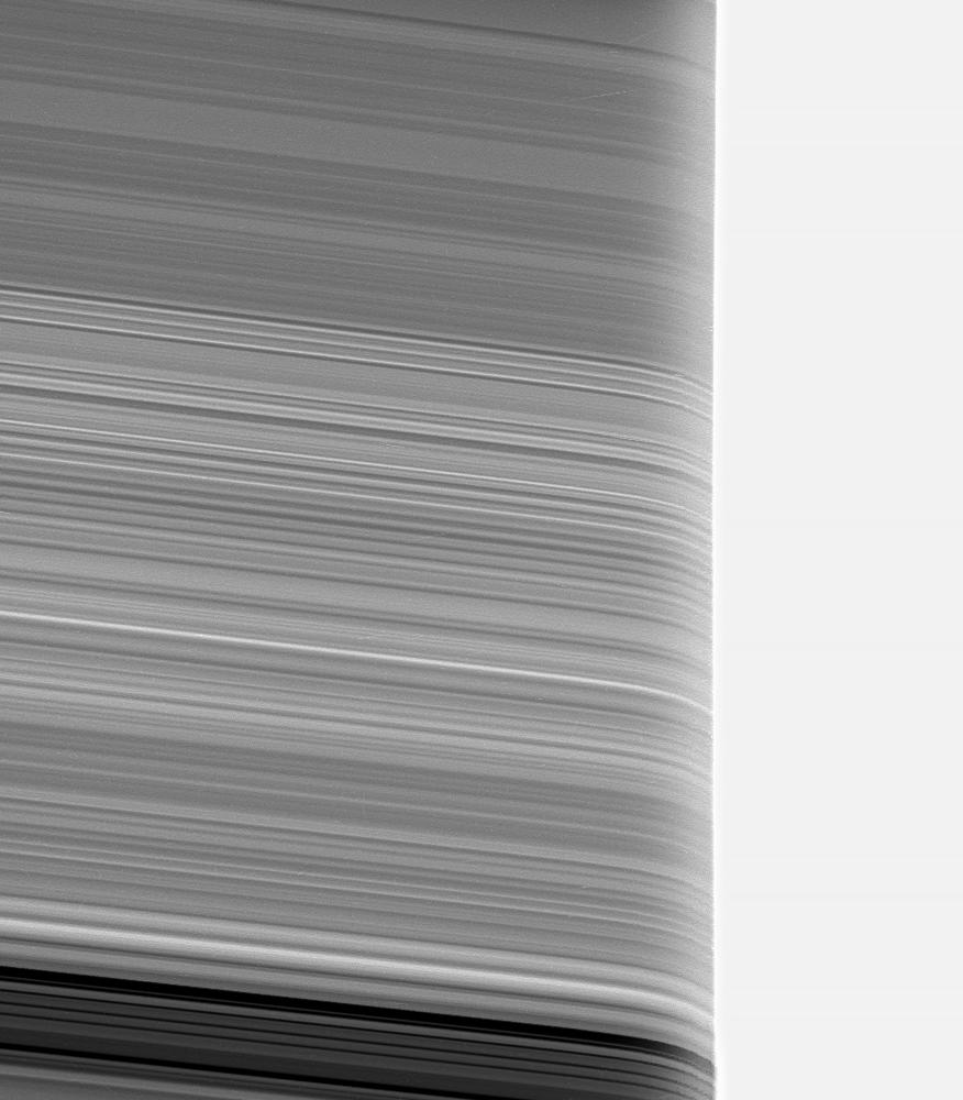 Saturn's rings appear strangely warped in this view of the rings seen through the upper Saturn atmosphere