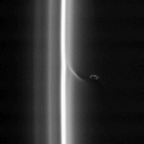 This view, like PIA08303, shows Prometheus with a streamer it has created in the inner edge of the F ring.