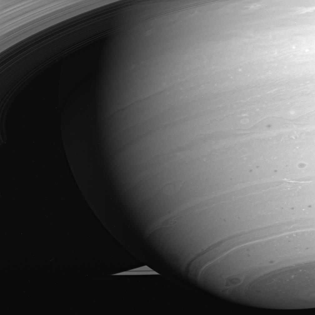 This is an image of the swirling storms of Saturn