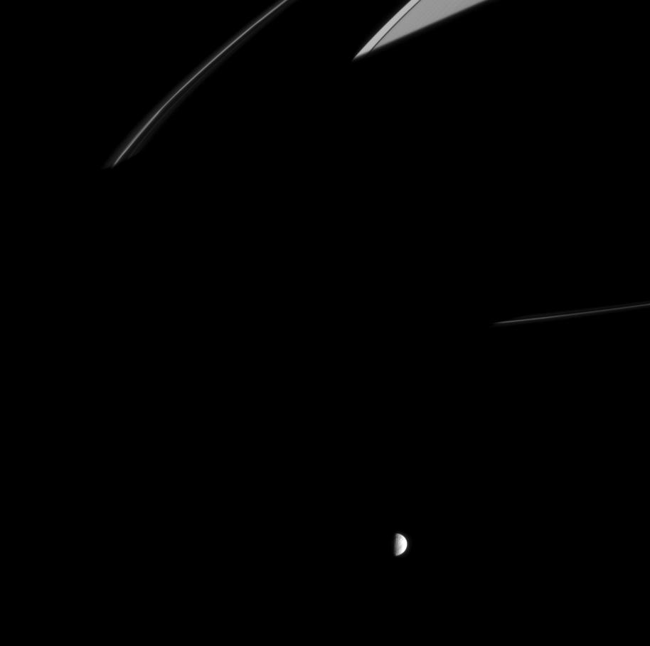 Saturn's shadow hides rings as Mimas orbits Saturn