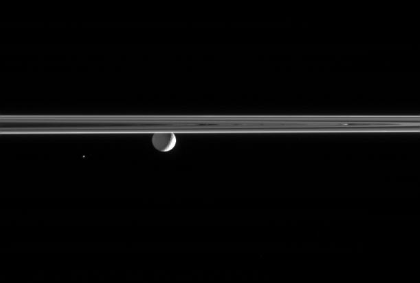 Saturn's moons Mimas and Helene near a portion of the rings