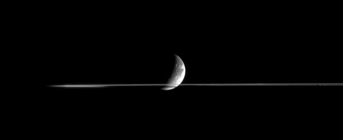 Dione and a portion of Saturn's rings