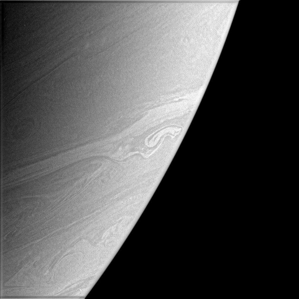 This atmospheric close-up shows a bright, somewhat distorted feature in Saturn's southern hemisphere