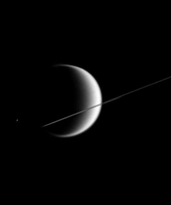 Titan behind Saturn's nearly edge-on rings