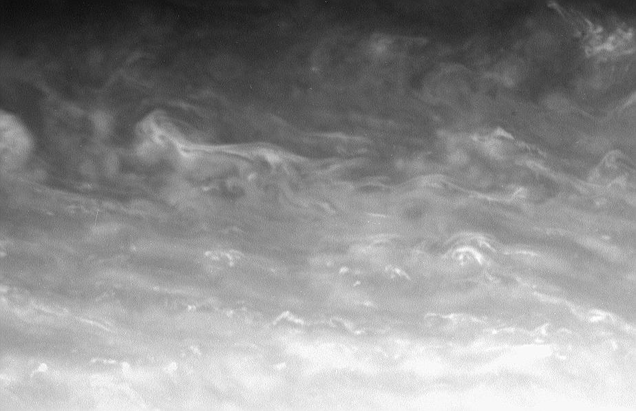 Convective clouds drift through a region just north of Saturn's bright equatorial band
