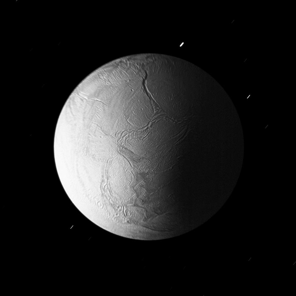 In Saturn's shadow, the southern hemisphere of Enceladus is lit by sunlight reflected first off of the rings and then onto the nightside of the planet.
