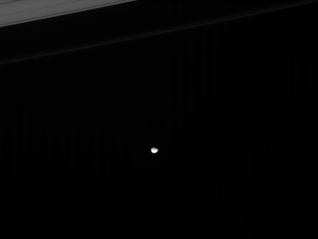 Janus skirts the edges of Saturn's main rings