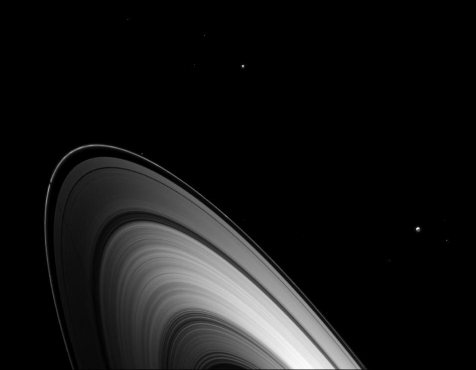 Just before Saturn's August 2009 equinox, Dione joined other Saturnian moons in casting shadows on the planet's main rings.
