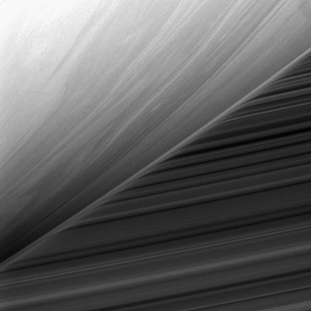 The cloud-streaked limb of Saturn in front of the planet's B ring