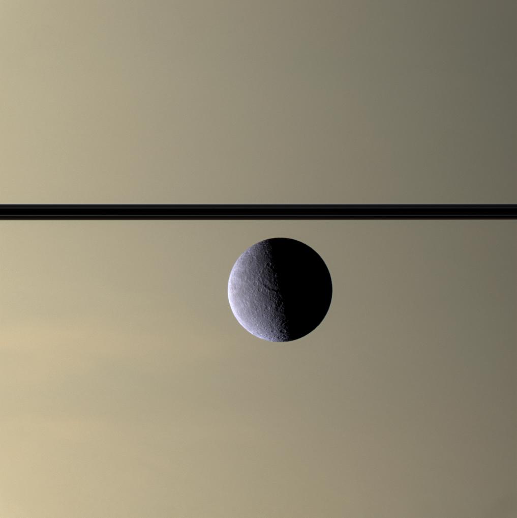 Rhea in front of Saturn