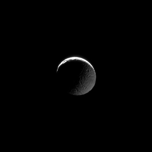 The transition from light to dark takes place on two fronts in this image of Mimas.