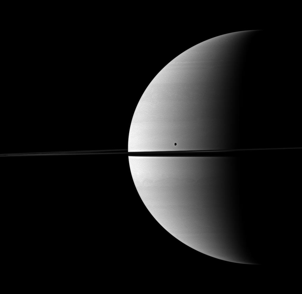 Saturn shares its space with its moon Tethys in this Cassini-captured scene.