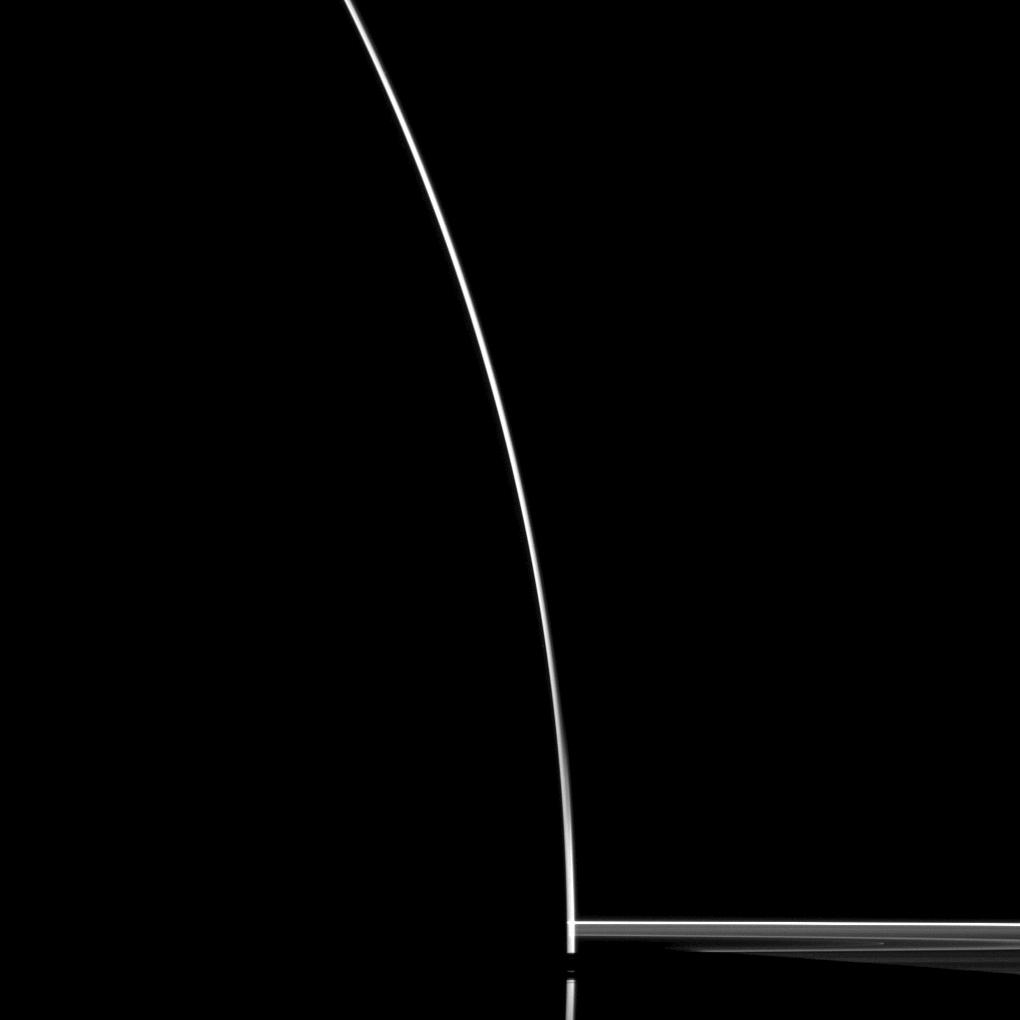 A startling silhouette of Saturn is created in this Cassini spacecraft portrait.