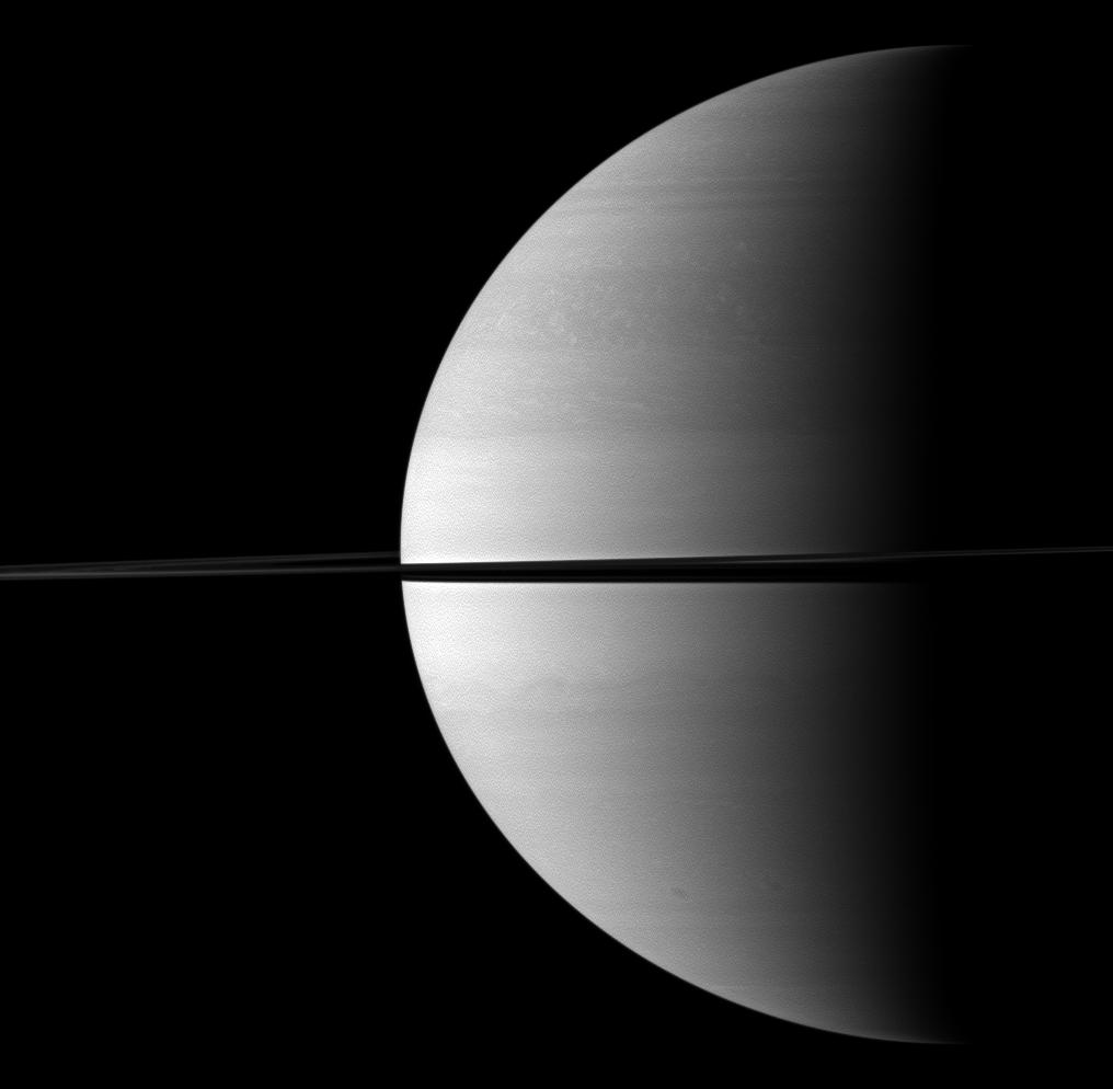 Roughly a quarter of majestic Saturn is illuminated in this view captured while the Cassini spacecraft was orbiting near the planet's equatorial plane.