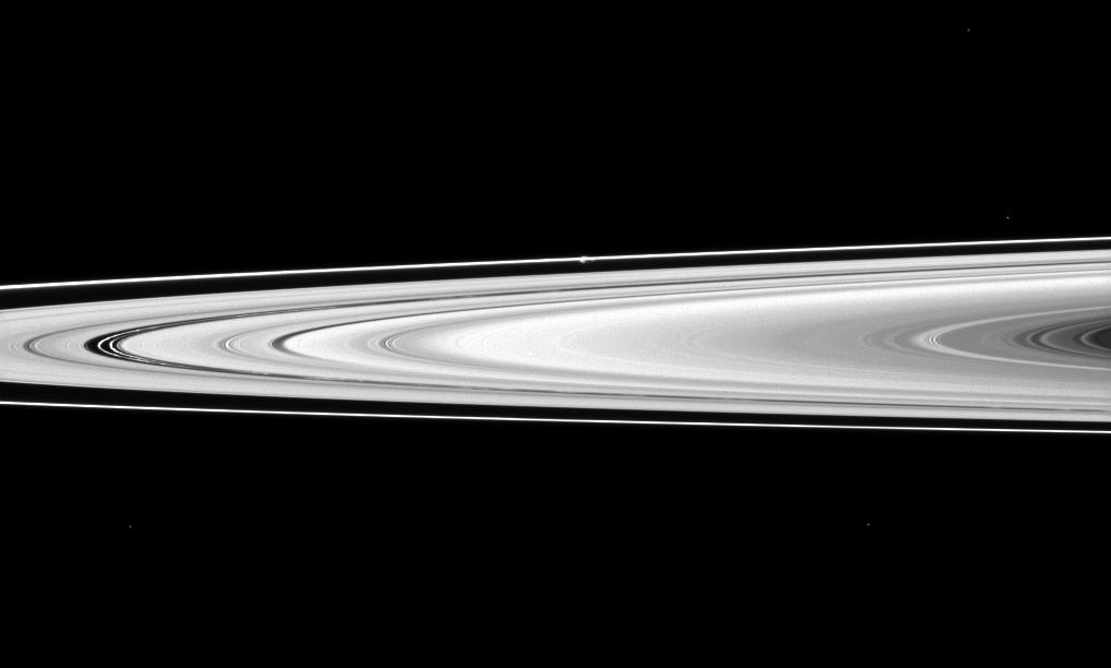 Prometheus looks like a small white bulge near the F ring -- the outermost ring seen here -- above the center of the image.