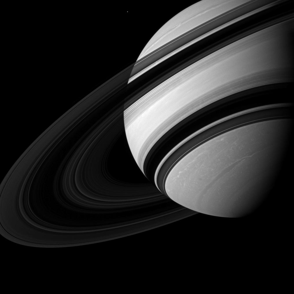 Saturn's moon Mimas appears near Saturn