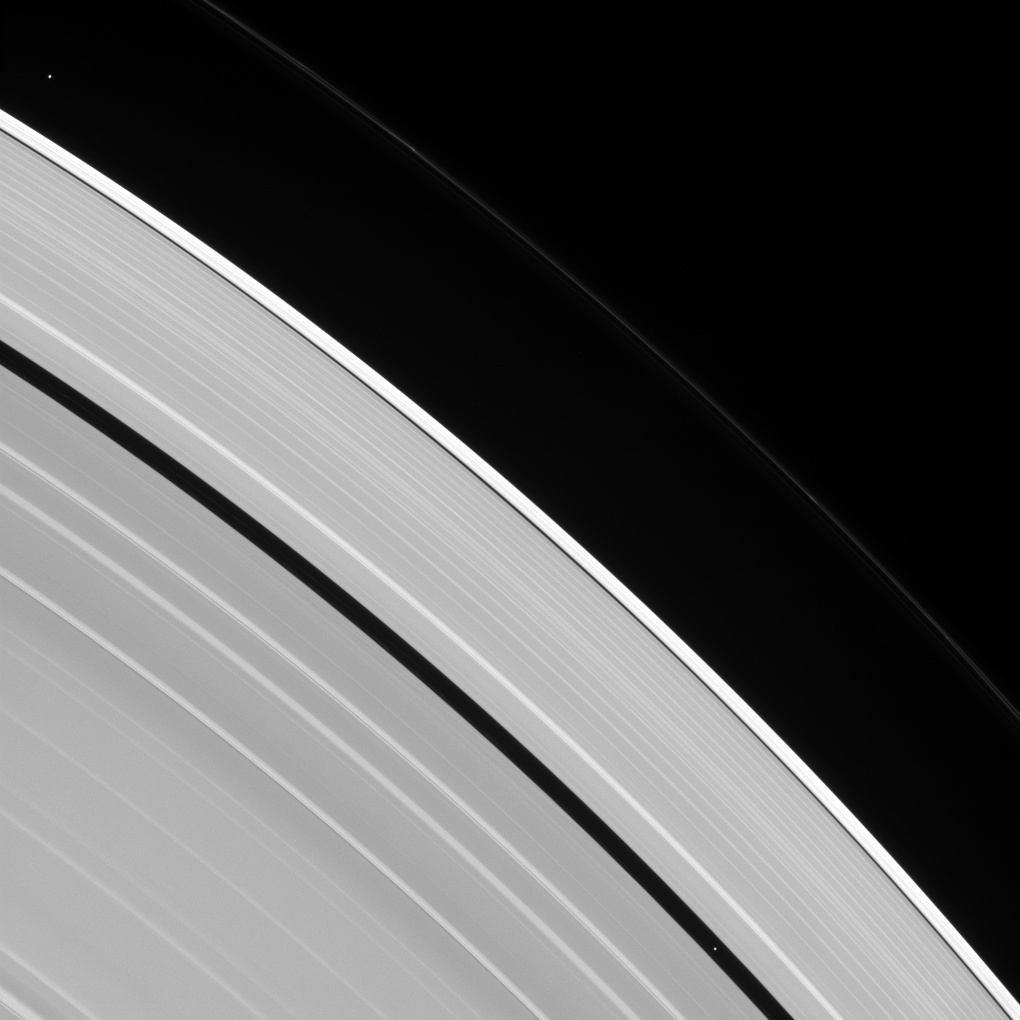 Saturn's rings and two tiny moons of Saturn: Pan and Atlas