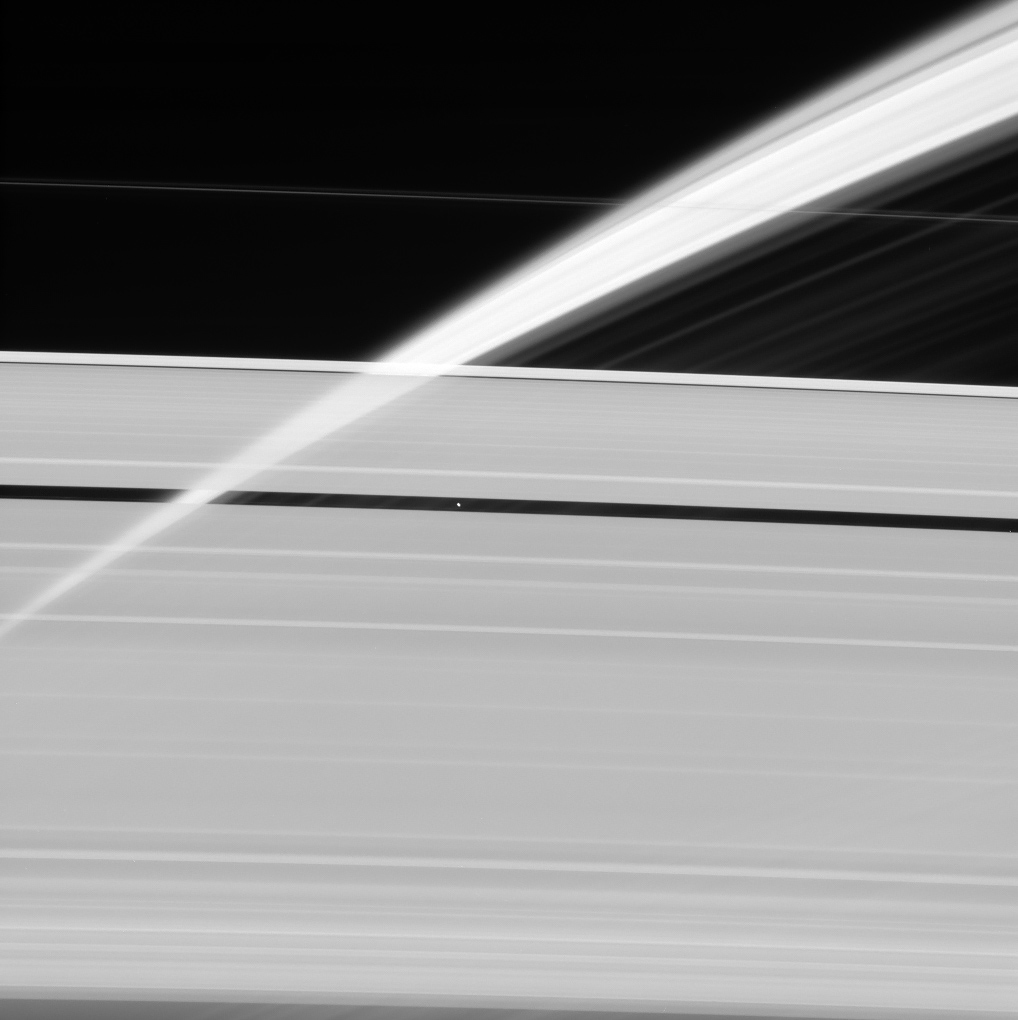 Saturn's rings form a translucent veil in this view from NASA’s Cassini spacecraft