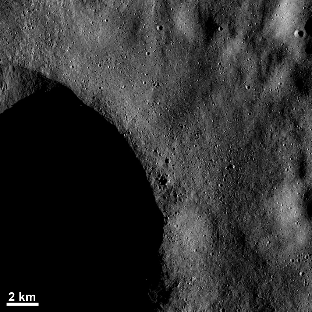 Blocks of Ejected Material and Small Craters Near a Crater Rim