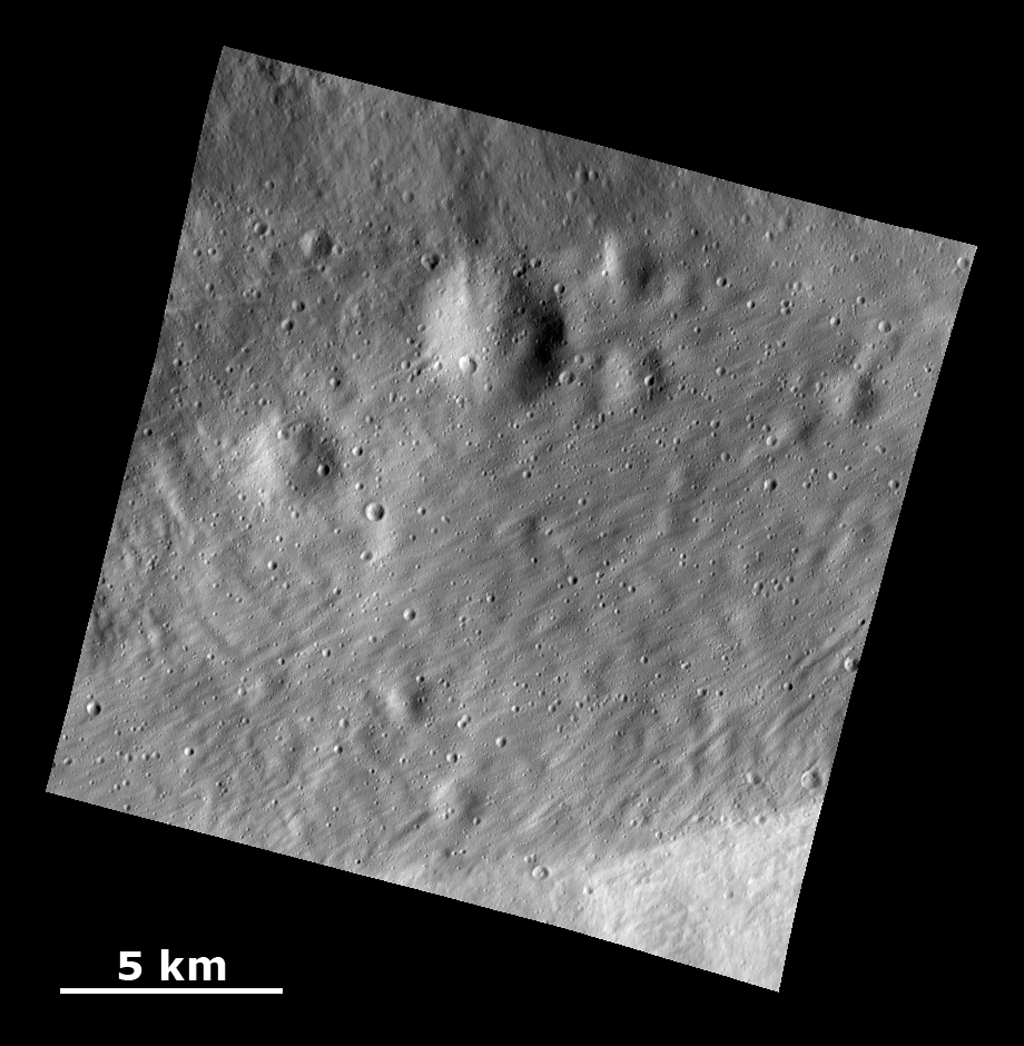Smooth Ejecta with Grooved Surface Showing Buried Craters