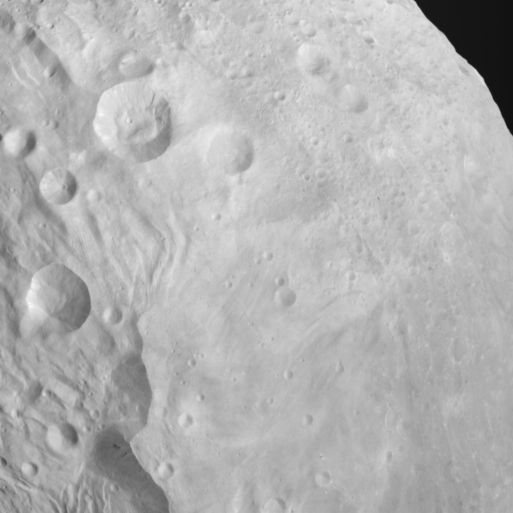 Craters, Scarps, Troughs, Grooves and Plains on Vesta