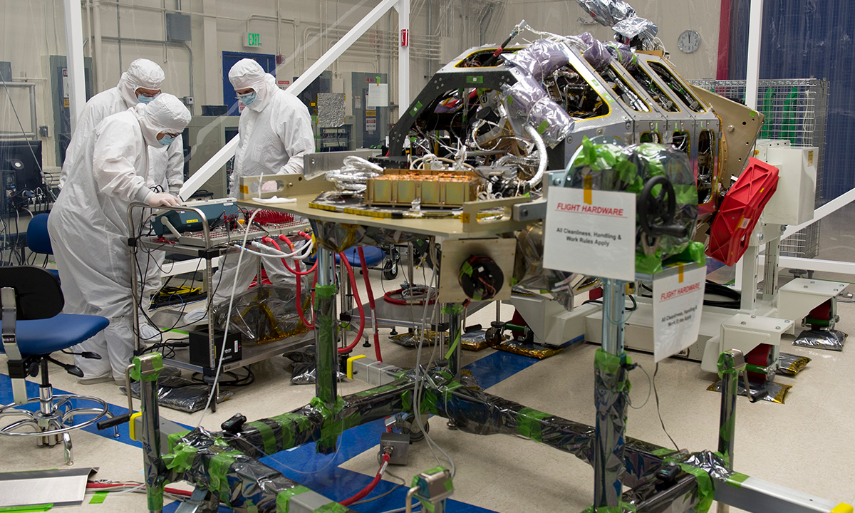 A team of engineers at NASA's Ames Research Center, Moffett Field, Calif., tests an electrical interface on the Lunar Atmosphere and Dust Environment Explorer (LADEE) spacecraft to ensure all of the cable pins are in the correct location and that it is safe to connect.