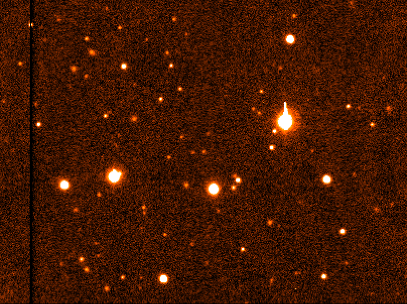 The small dot moving slightly off to the left of center in this image is newly-discovered Kuiper Belt object 2004 DW.