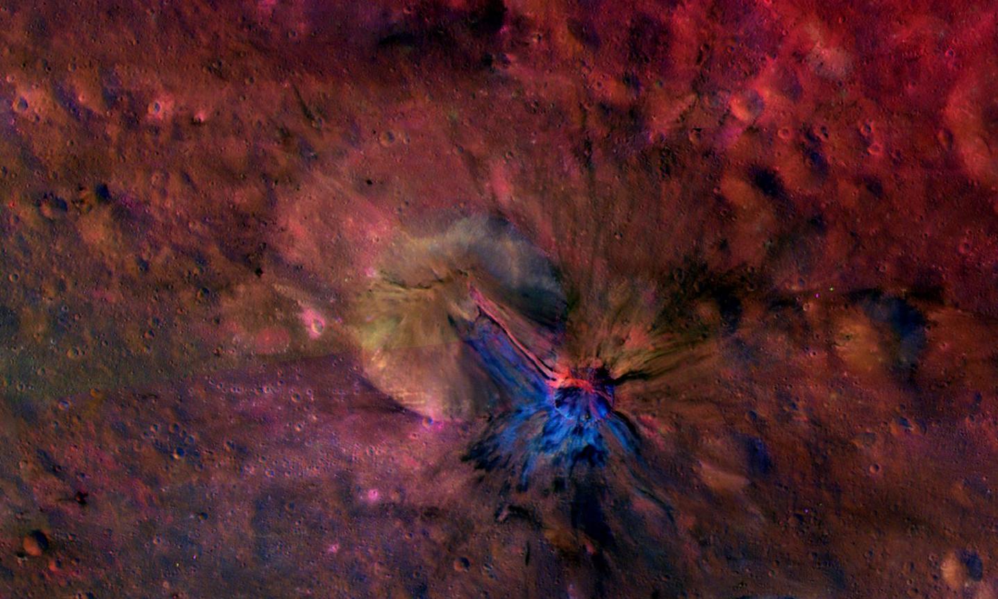 This colorful composite image from NASA's Dawn mission shows the flow of material inside and outside a crater called Aelia on the giant asteroid Vesta.
