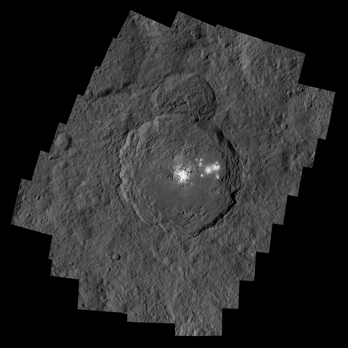 Occator Crater, measuring 57 miles (92 kilometers) across and 2.5 miles (4 kilometers) deep, contains the brightest area on Ceres.