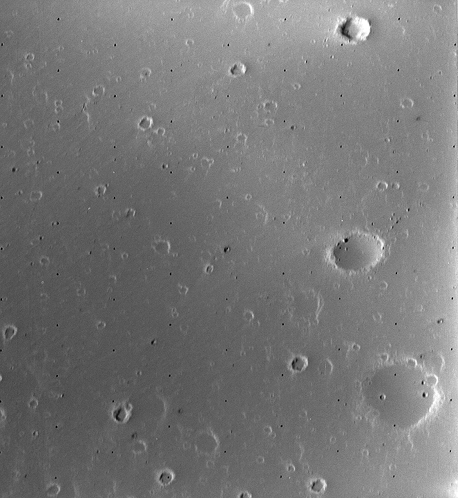 Close-up image of Mars' satellite Deimos from the Viking 2 Orbiter showing craters and associated streaks.