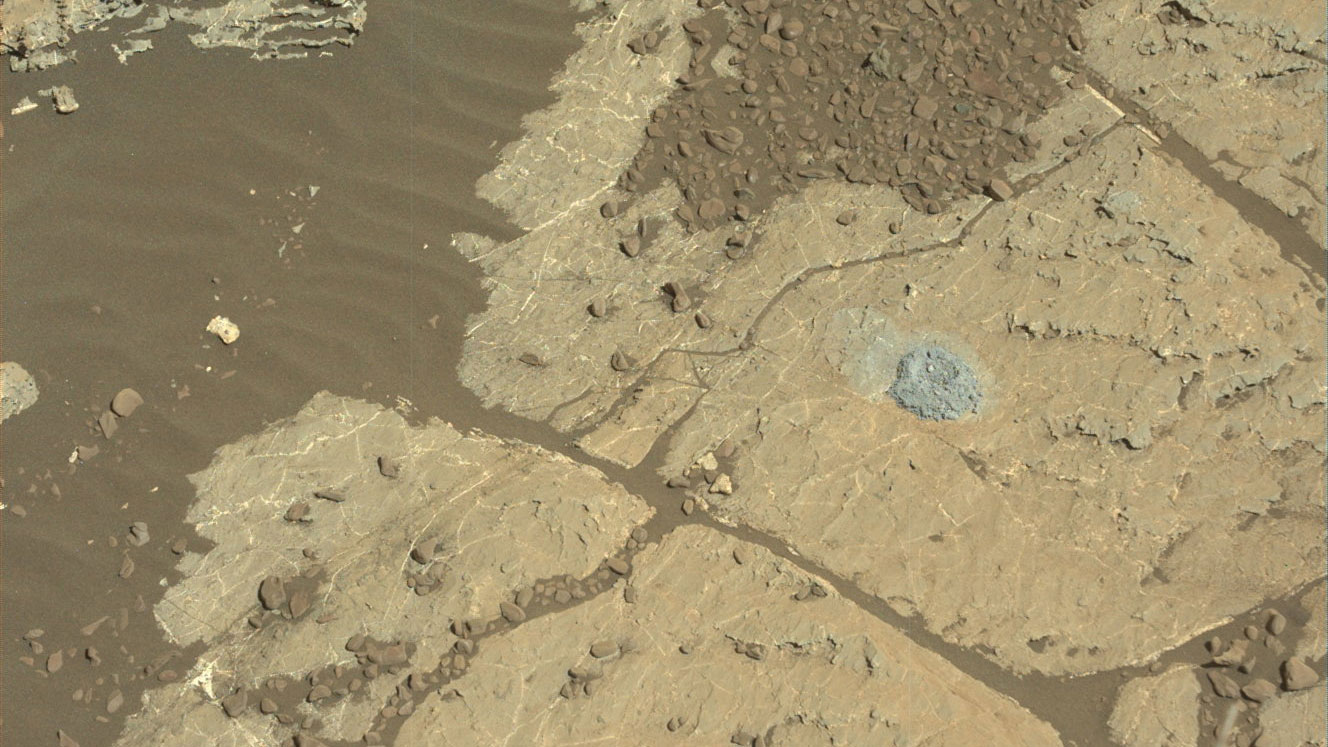 A hole in Lake Orcadie marks Curiosity's first operation of the rover drill since a motor problem